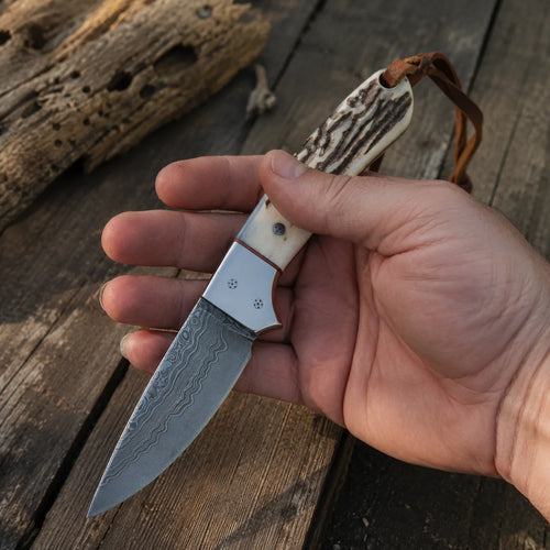 Cross Draw Knife – Damascus Steel, Antler Horn Handle, Steel Bolster & Leather Sheath | 6.25"