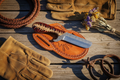 Red Mesa Ranch Bull Cutter Knife with a handmade Rasp Steel blade, Red Epoxy Pine Cone Resin handle, 8-inch overall length, and genuine leather sheath.